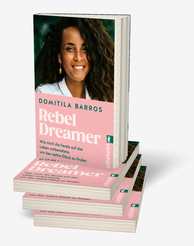 Exemplares do livro Rebel Dreamer, de Domitila Barros